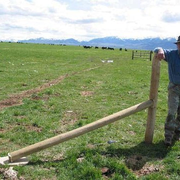 A man with a finished corner post brace assembly using  floating brace