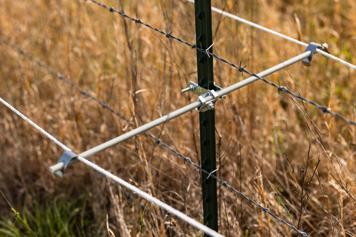 Utilizer fiberglass rod with UltraVeil on a T-post for electric fence