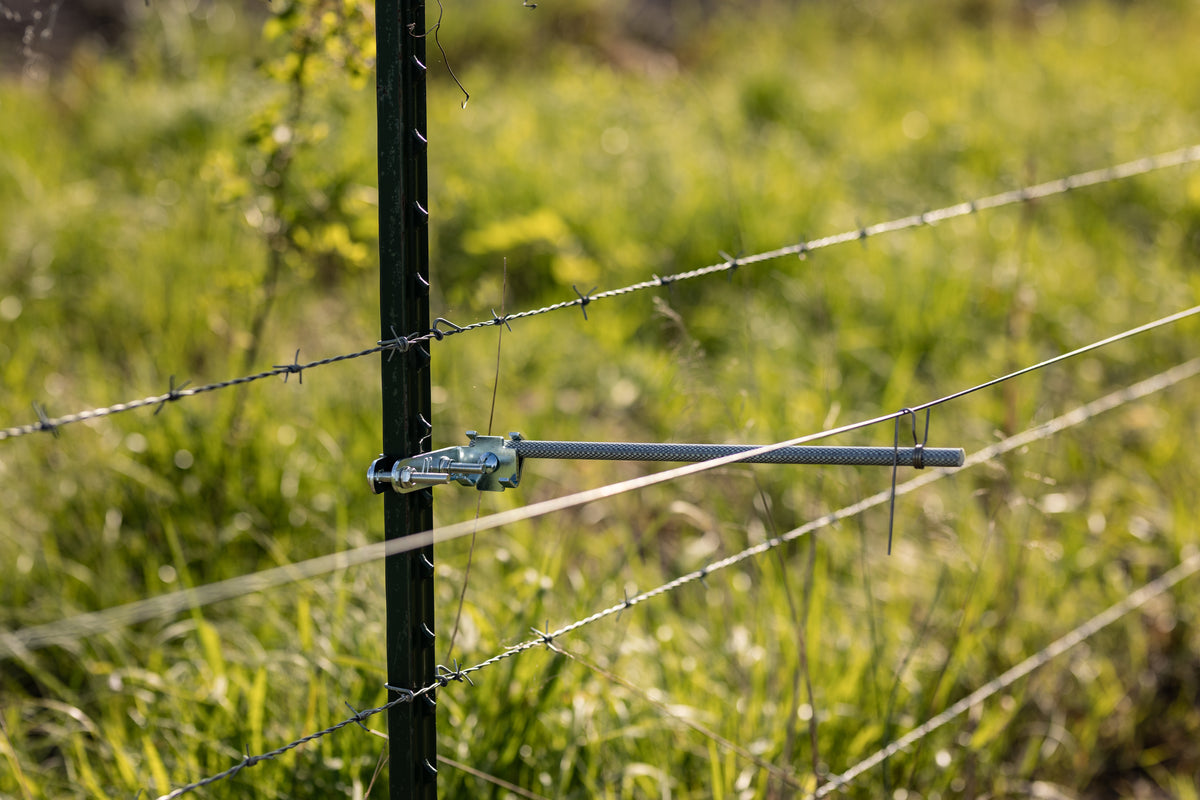 Utilizer fiberglass rod with UltraVeil on a T-post for electric fence