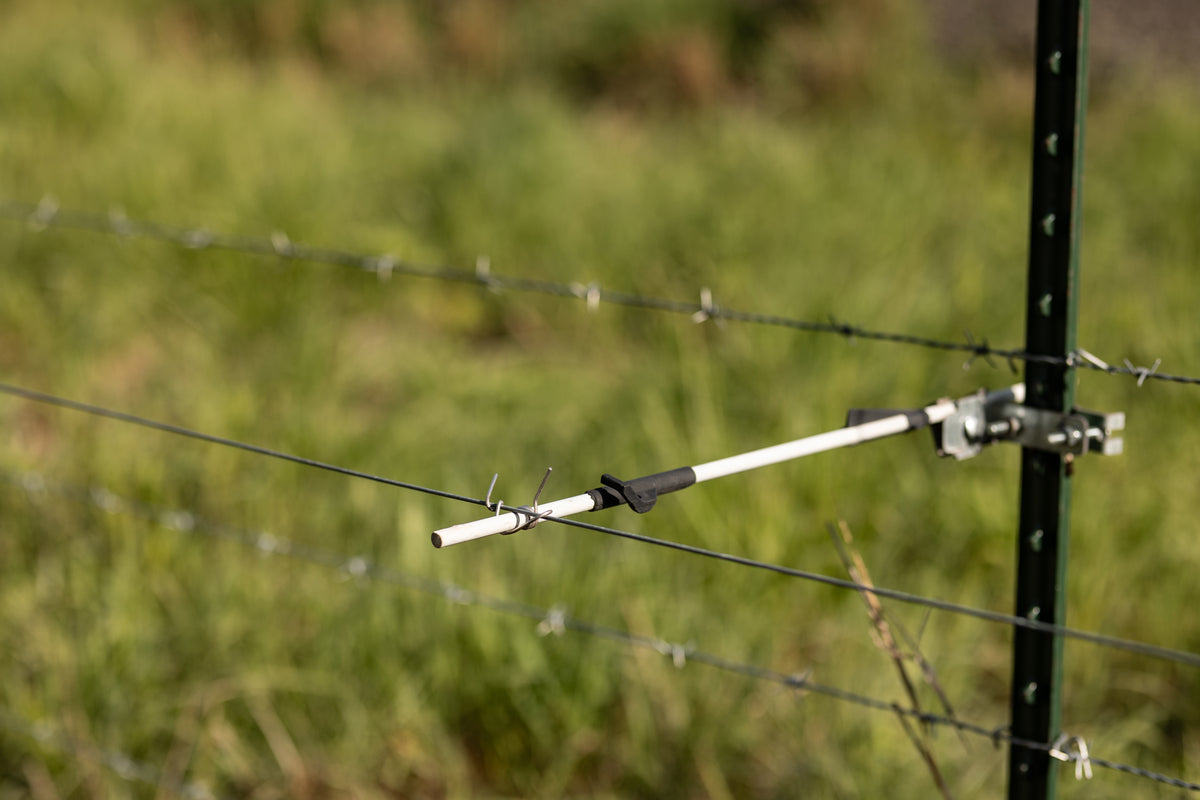 Utilizer fiberglass rod with UltraVeil on a T-post for electric fence