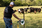 Utilizer poly wire reel holder mounted on a T-post for electric fence